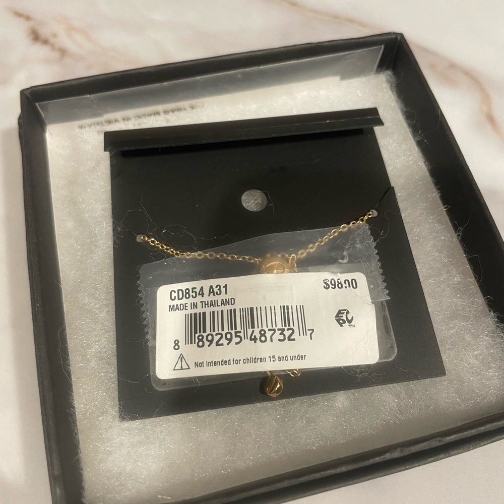Brand new COACH gold slider bracelet
